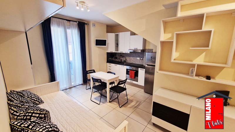 1693cucina_abitabile-divano-letto-matrimoniale-tavolo-pranzo-airbnb-villapizzone-milano