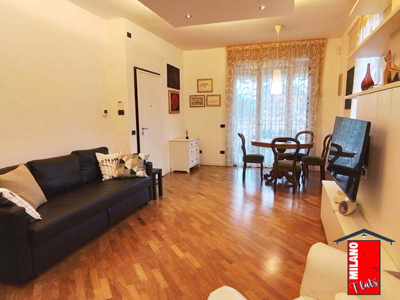 927soggiorno-divano-letto-tavolo-pranzo-terrazzo-vivibile-appartamento-via-golinelli-segrate-mi